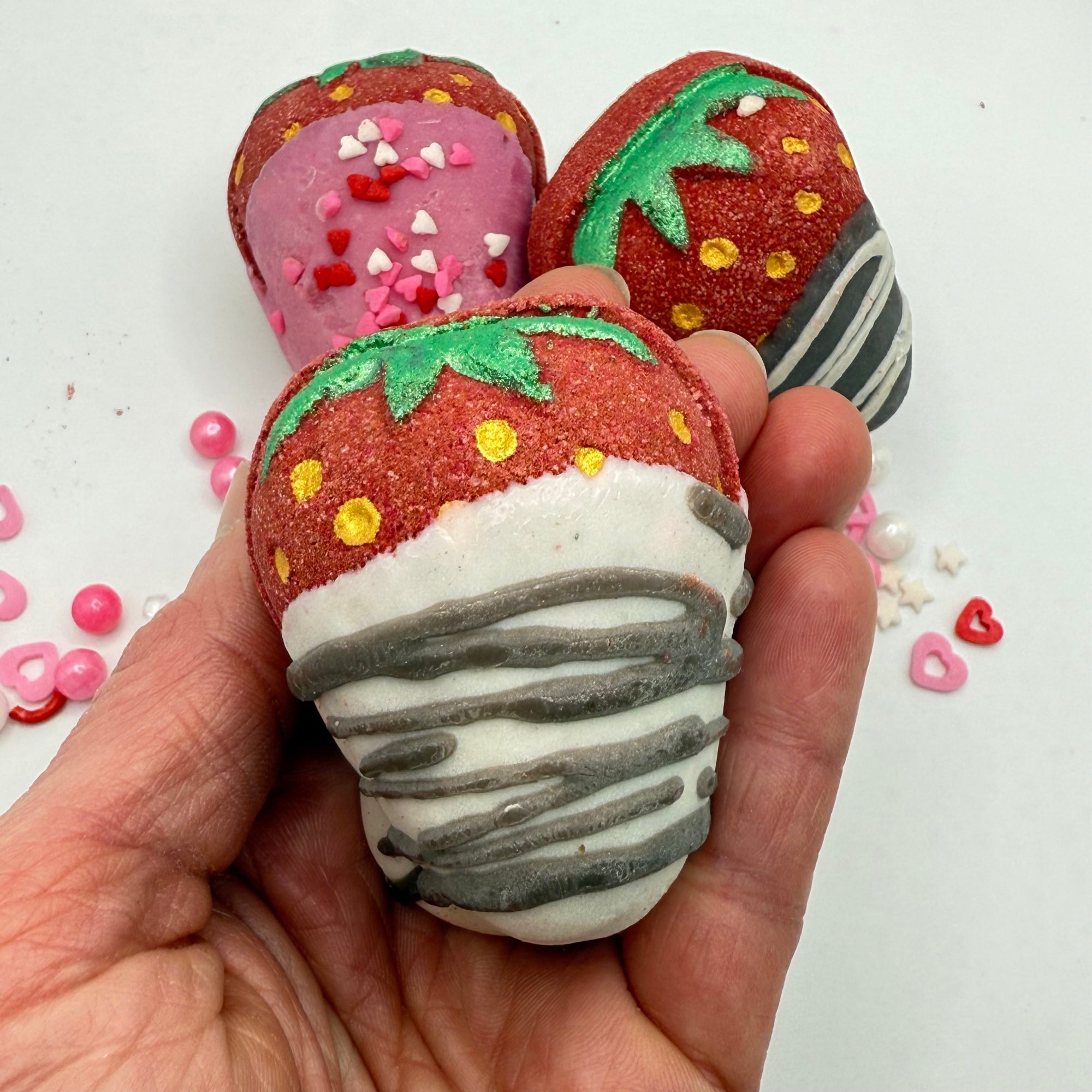 Strawberry bath bomb dipped in coco butter to look like a chocolate covered strawberry by Rusted Acre Soap Co