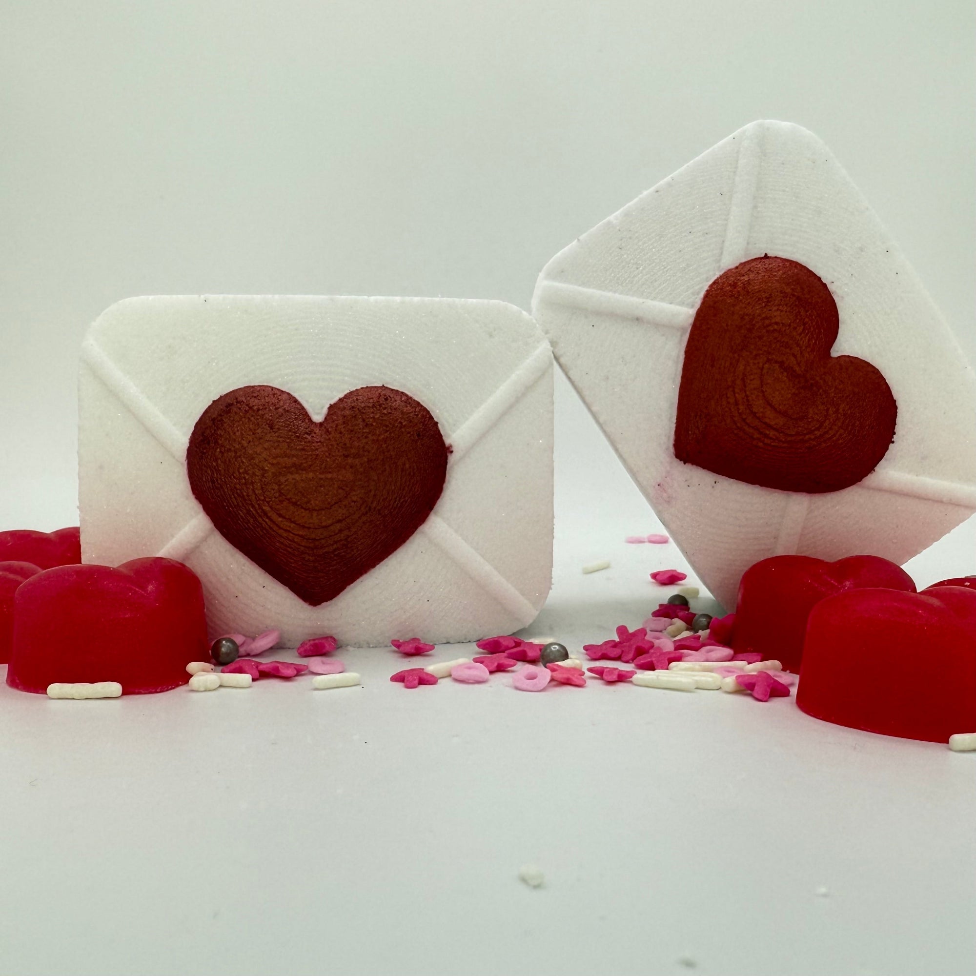 Two Rusted Acre Soap Co white and red heart Love letter bath bombs.