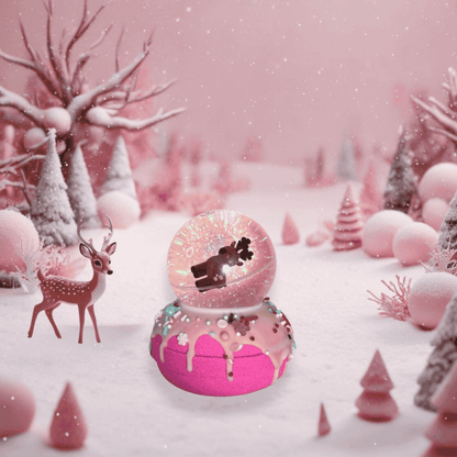 A reindeer snow globe bath bomb from Rusted Acre Soap Co. displayed on a snowy background. A fawn curiously approaching.