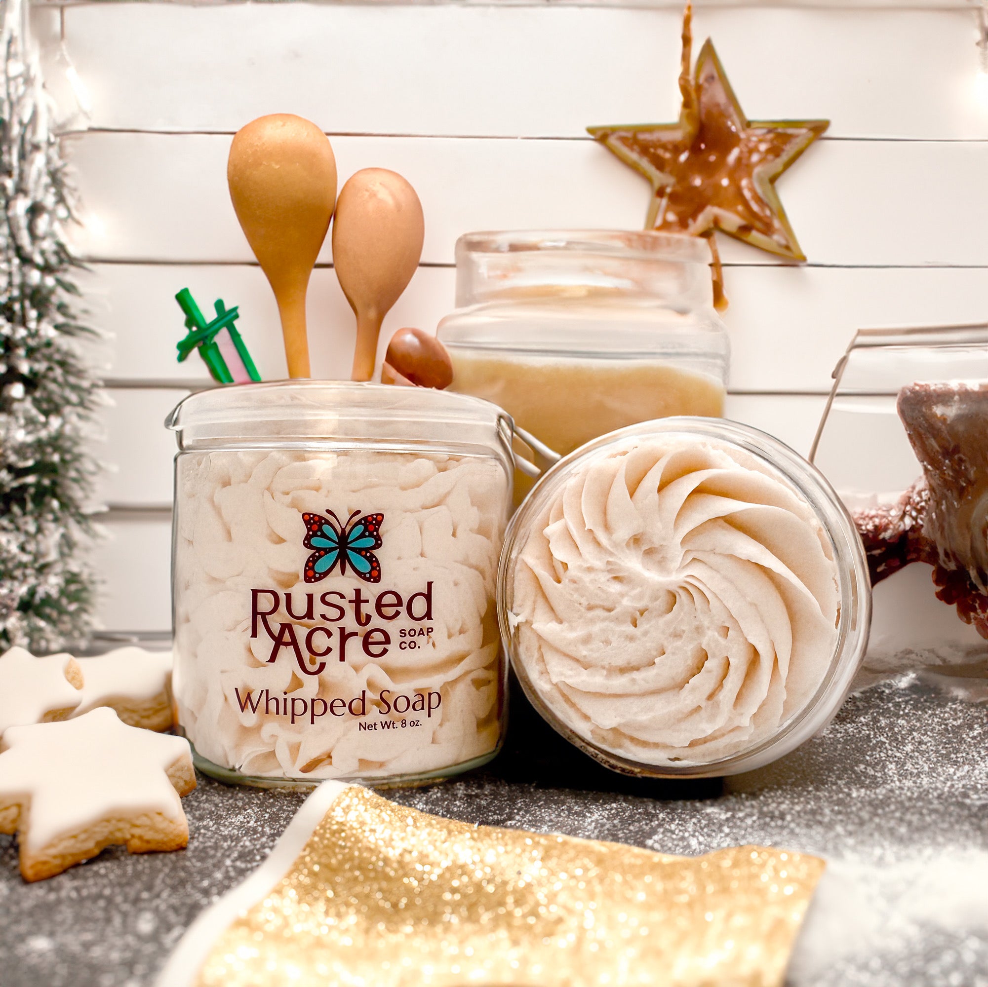 Two jars of Rusted Acre Soap Company’s sugar cookie whipped soap front and top view in a lifestyle setting.