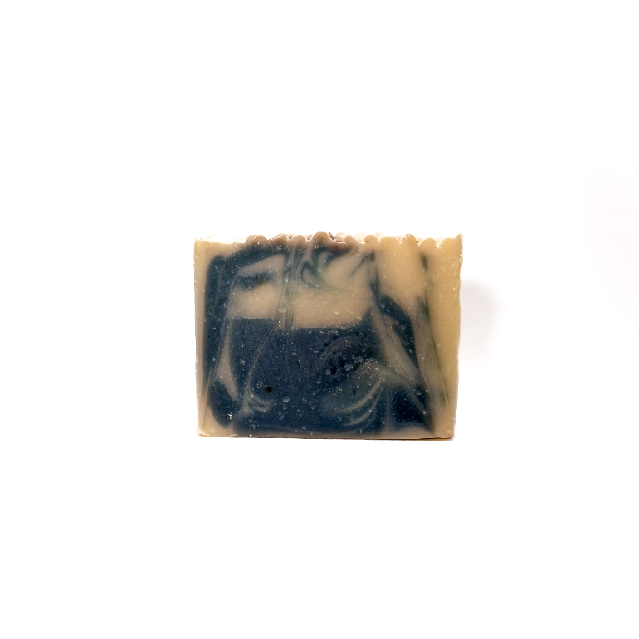 A handmade bar soap from Rusted Acre Soap Company. Colors are swirled gray and natural tan.